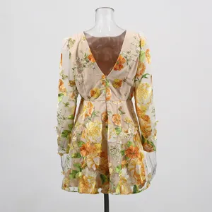 Pastoral style floral embroidered mesh mini dress with sheer long sleeves and V-back.