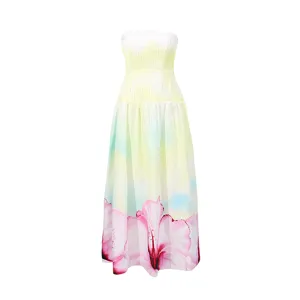 Summer gradient yellow strapless long dress with pink floral hem, perfect for beach vacation.