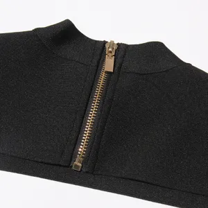 Close up view of women black top back zipper detail, premium metallic hardware texture.