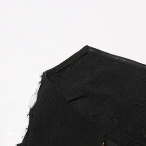 Black rhinestone bandeau dress detail view, textured knit fabric with sparkling crystal embellishments.