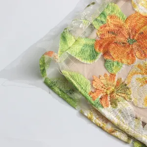 Detail view of pastoral floral embroidered mesh fabric dress, sweet summer style dress for women.