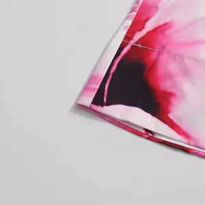 Pink gradient abstract printed fabric detail of the stylish summer dress, fine texture.