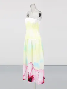 Gradient yellow strapless long dress with floral print, perfect for summer resort wear.