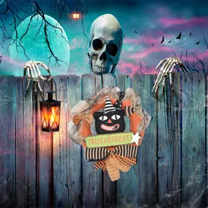 Detailed view of Halloween black cat wreath with mesh ribbons and spooky fence backdrop.