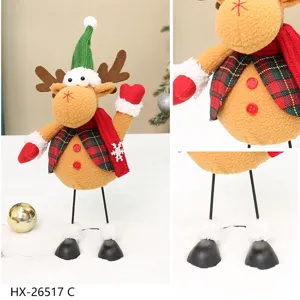 Christmas reindeer plush toy detail view, festive plaid vest and holiday decoration.