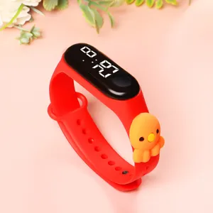 Children cartoon electronic watch detail, red silicone band with cute animal charm, LED display.