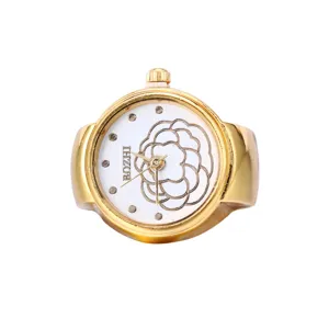 Gold tone alloy ring watch featuring a stylish white dial with elegant floral motif design.