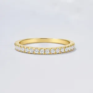 Close-up of the delicate half eternity paved zirconia ring, showcasing sparkling stones and gold finish.