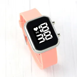 Detailed view of the pink silicone LED digital watch, featuring a modern square display.
