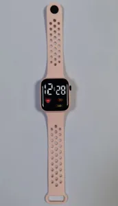 Pink square LED digital smartwatch with perforated breathable silicone sports band for kids.