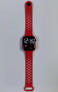 Red LED digital smartwatch with perforated silicone strap for children daily sports.