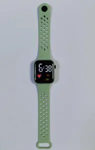 Green LED digital electronic watch with breathable silicone strap for kids and students.