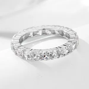 Close-up detail of sparkling ice-cut zircon full eternity ring in silver tone design.