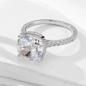 Close-up detail of a 10x10mm cushion cut cubic zirconia ring with pavé set side stones.