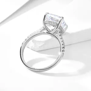 Close-up detail shot of a silver cubic zirconia ring featuring a sparkling cushion cut center stone.