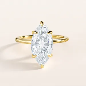Detailed view of the exquisite marquise cut zircon ring with polished gold band sparkle.