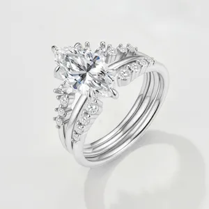 Close-up detail of sparkling marquise moissanite stacking ring crown set in silver.