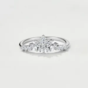 Detailed close-up view of the marquise moissanite stones and sterling silver crown.