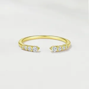 Exquisite detail of S925 sterling silver open moissanite ring with sparkling paved stones.