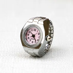 Close-up detail of the creative silver metal ring watch featuring a charming pink dial.