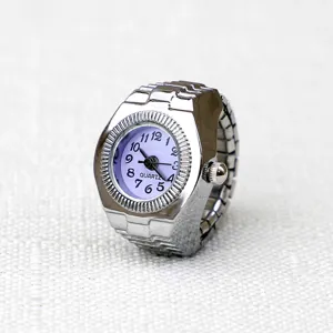Silver tone metal stretch band ring watch with purple dial and clear quartz numbers.