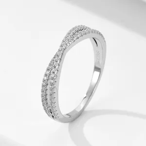 Detailed view of silver twisted pave zirconia ring, delicate sparkle jewelry piece.