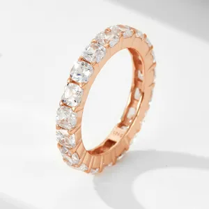 Rose gold full eternity ring featuring sparkling cushion-cut cubic zirconia stones, fine detail view.