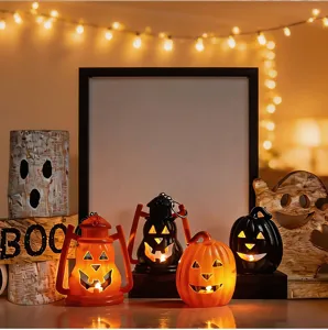 Halloween decorative pumpkin lights scene display detail with glowing LED electronic candles.