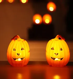 Halloween glowing LED pumpkin lights pair, perfect spooky night light decor for holiday party.