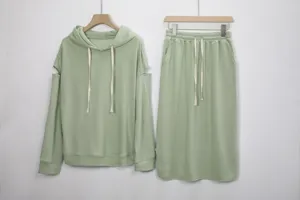 Light green hooded sweatshirt and skirt set, casual long sleeve cold shoulder two piece outfit.