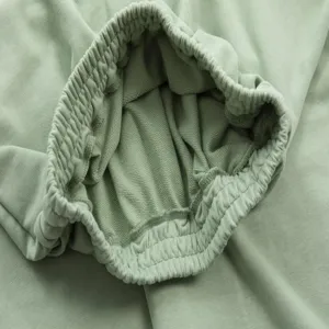 Close-up view of the elastic waistband and soft cotton loop-back fabric detail of casual apparel.