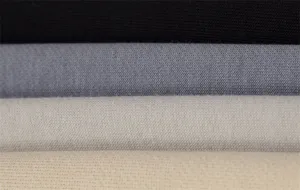 Cotton knit fabric material detail close-up view showing multiple color options clearly.