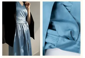 Détail de robe élégante en soie bleue française, confection exquise et texture douce.