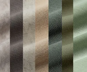 Cotton hoodie fabric detail closeup showing multiple solid color texture options clearly.