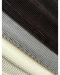Corduroy fabric detail close-up showing soft ribbed texture and multiple color options.
