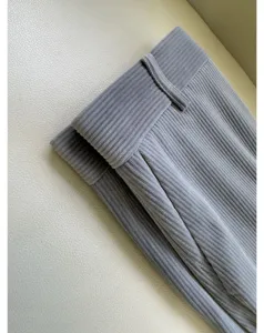 Gray corduroy pants fabric detail, soft texture straight trousers close up view for women