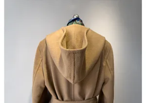 Camel hooded woolen coat back detail, classic wrap design with belt, premium winter outerwear.
