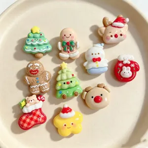 Cute Christmas brooch detail shot showing assorted resin charms like snowman, gingerbread man and tree.