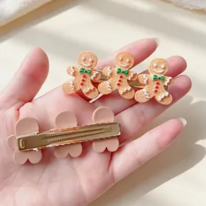 Jolie pince à cheveux en pain d'épices de noël accessoire mignon pour femmes et filles.