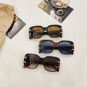 Trendy square sunglasses with thick frames and metal side accents for men and women.