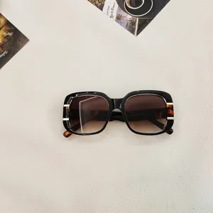 Stylish square sunglasses for men and women with UV protection and trendy fashion design.