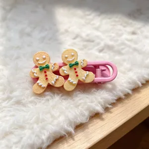 Cute Christmas gingerbread hair clip detail, sweet pink side clip for women and girls.