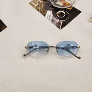 Chic rimless gradient blue sunglasses with unique snake head metal temples for women.