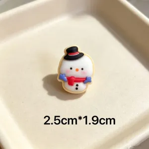 Cute cartoon snowman Christmas charm detail view, colorful resin pin accessory for festive decor.
