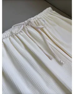 Off-white corduroy lounge pants detail, elastic drawstring waist, lightweight comfy trousers