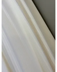 Close-up detail of soft corduroy fabric showing fine vertical texture and draping quality.