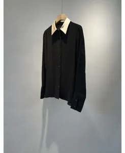 Elegant black long-sleeve blouse with a contrasting white collar, smooth and wrinkle-resistant.