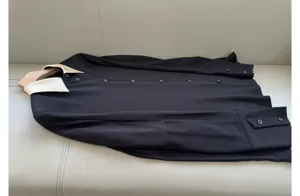 Elegant black long-sleeve shirt with contrast collar, silk-feel fabric, stylish design.