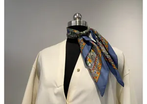 Elegant multi-color patterned silk scarf perfect gecombineerd met a classic white shirt.
