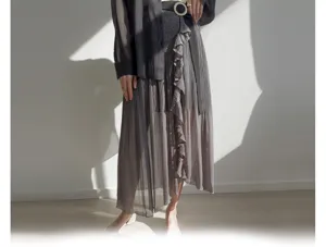 Detailed view of the Japanese style pleated midi skirt with ruffles and high waist design.